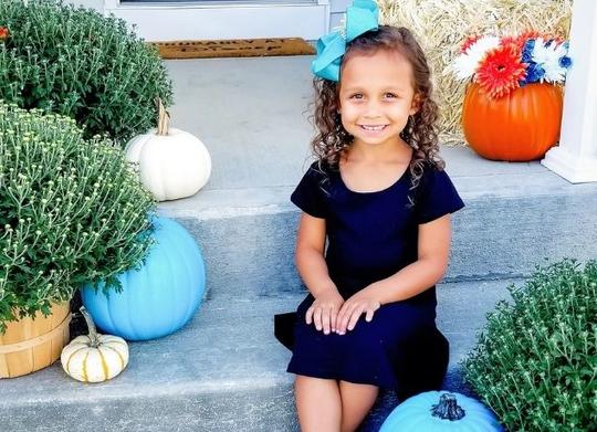 Girl with teal pumpkins