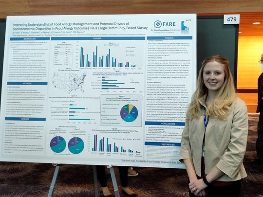 Jenna Yost with CAP poster AAAAI 2022.jpg