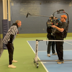 Behind the scenes filming at the pickleball court