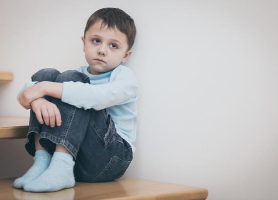 sad boy on stairs