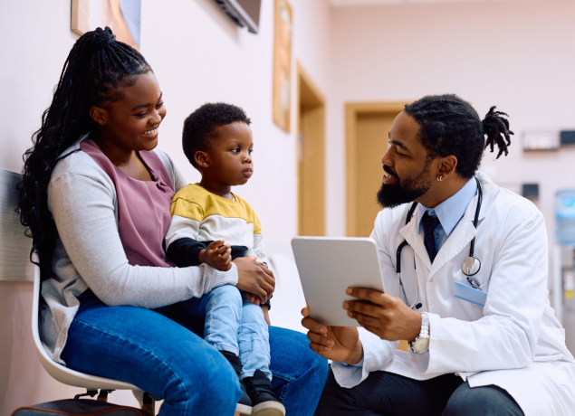 Doctor talking to a mother and son