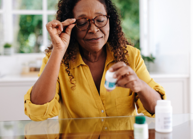 Woman looking at medicine
