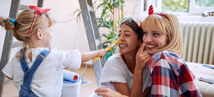 Kid painting mom's nose