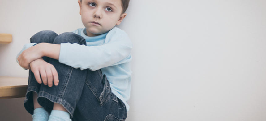 sad boy on stairs