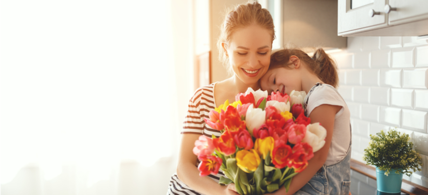 mom and daughter with flowers