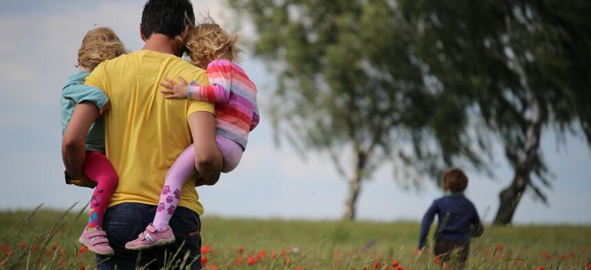 Father and children outside